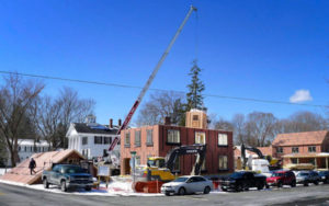 "Flying Bathroom Pod" being lowered into place.